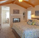 Master bedroom with king size bed and smart tv
