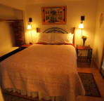 Queen size bed. Door leads out to patio and hot tub