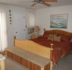 Large Master Bedroom with AC and ceiling fan.