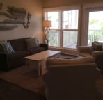 The large first floor living room has a smart tv and lots of room to spread out. A door from this room leads to a large deck.