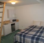 Typical suite with Queen bed and two singles in loft (up ladder)
