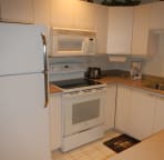 Spacious kitchen with new flattop stove.