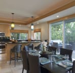 open dining area and kitchen
with bar. Sliding doors to lanai