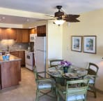 Enjoy the dinette area. Notice the tropical fan and decor.