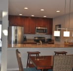 Newly updated kitchen with granite counters and stainless appliances. Open to dining area and family room.