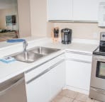 Well stocked kitchen with Keurig maker, Coffee maker, CrockPot and more.