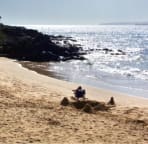 Relaxing Kamaole III beach with view of Molokini and Kaho'olawe in distance