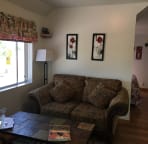 Living room with open pasture next door.