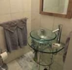 Marble walls and floors in the main bathroom