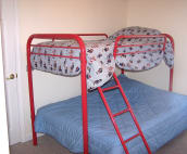 Bedroom #4 has wall-mounted flat screen TV to keep it out of the way of kids