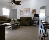 This is the living room, in the back you see the 2nd bathromm and 2 bedrooms next to it, the 3rd you see in the left corner