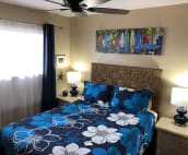 Light and bright guest bedroom with queen bed