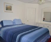 master bedroom with king bed and with bathroom ensuite