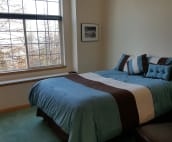 D Suite bed and filtered Lake Pend Oreille view.