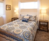 Queen bedroom upstairs with smart tv