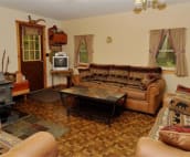 Living Room with Wood Burning Franklin Stove