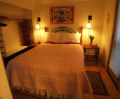 Queen size bed. Door leads out to patio and hot tub