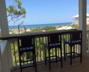 The reclaimed cypress bar is the perfect place to enjoy coffee or cocktails.