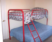 Bedroom #4 has wall-mounted flat screen TV to keep it out of the way of kids