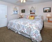 master bedroom with extremely comfortable king size bed and flat screen TV