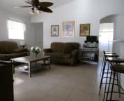 This is the living room, in the back you see the 2nd bathromm and 2 bedrooms next to it, the 3rd you see in the left corner