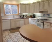 Our large kitchen with two ovens, gas stove, dishwasher, refrigerator and cooking gear.