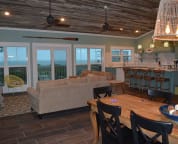 Spacious kitchen, living and dining room with tons of windows and unobstructed views of the Gulf.