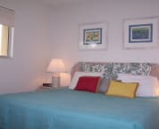 Guest bedroom with pillow-top king size bed and bay view