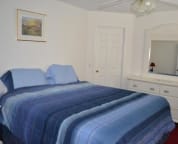 master bedroom with king bed and with bathroom ensuite