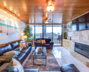 Lounge with leather sofas seating 7. Includes widescreen cable TV and fireplace.