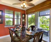 Morning Glory's tastefully decorated dining room leads to a wrap around lanai with built in Viking BBQ.
