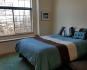 D Suite bed and filtered Lake Pend Oreille view.