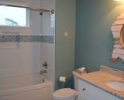 The first floor bathroom is shared by the bunk room and the third bedroom.