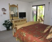 Master Bedroom w/King Bed & Dresser Including LCD TV w/Private Courtyard Access