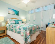 Soothing island colors. Queen bed with memory foam topper.