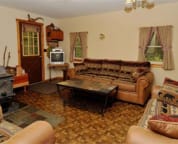 Living Room with Wood Burning Franklin Stove