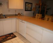 Large kitchen with built-in quiet Bosch dishwasher.