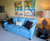 Brand new modern styled sleeper sofa, end tables, art work