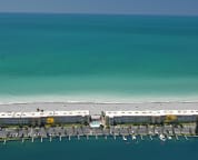 We are on a VERY narrow strip of sand with direct beach and bay views