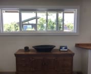 entry window with teak dresser