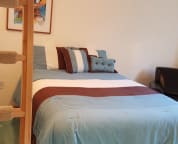 Typical suite with queen bed on main level and lofts above.
