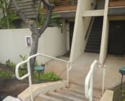 Four steps down to front door on left