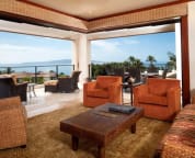 Living room and spacious corner unit deck and panoramic ocean view