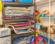 Ground floor storage closet with beach chairs, cooler, umbrella, toys and more