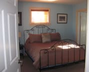 The other lower level guest room has a queen size bed