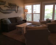 The large first floor living room has a smart tv and lots of room to spread out. A door from this room leads to a large deck.
