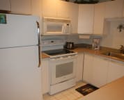 Spacious kitchen with new flattop stove.