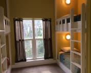 The bunk room includes four built-in bunk beds and is the perfect place for the kids to hang out.
