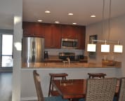 Newly updated kitchen with granite counters and stainless appliances. Open to dining area and family room.