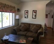 Living room with open pasture next door.